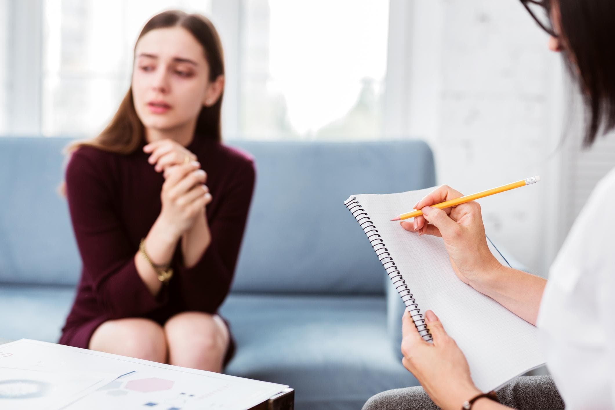 How the Management of Phobia Can Help  Counselor and client looking at a fear/anxiety worksheet