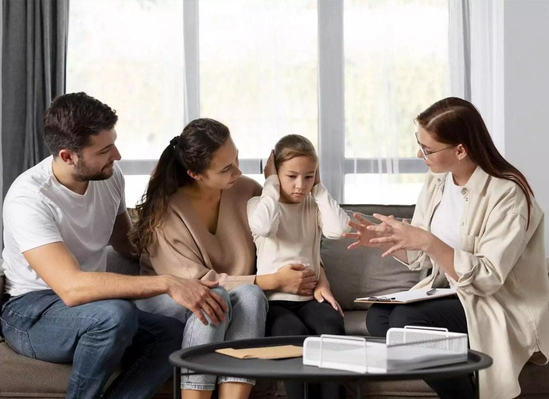 When Can Parent Child Counseling Help?, Mother, father, and child sitting together with a professional counselor.