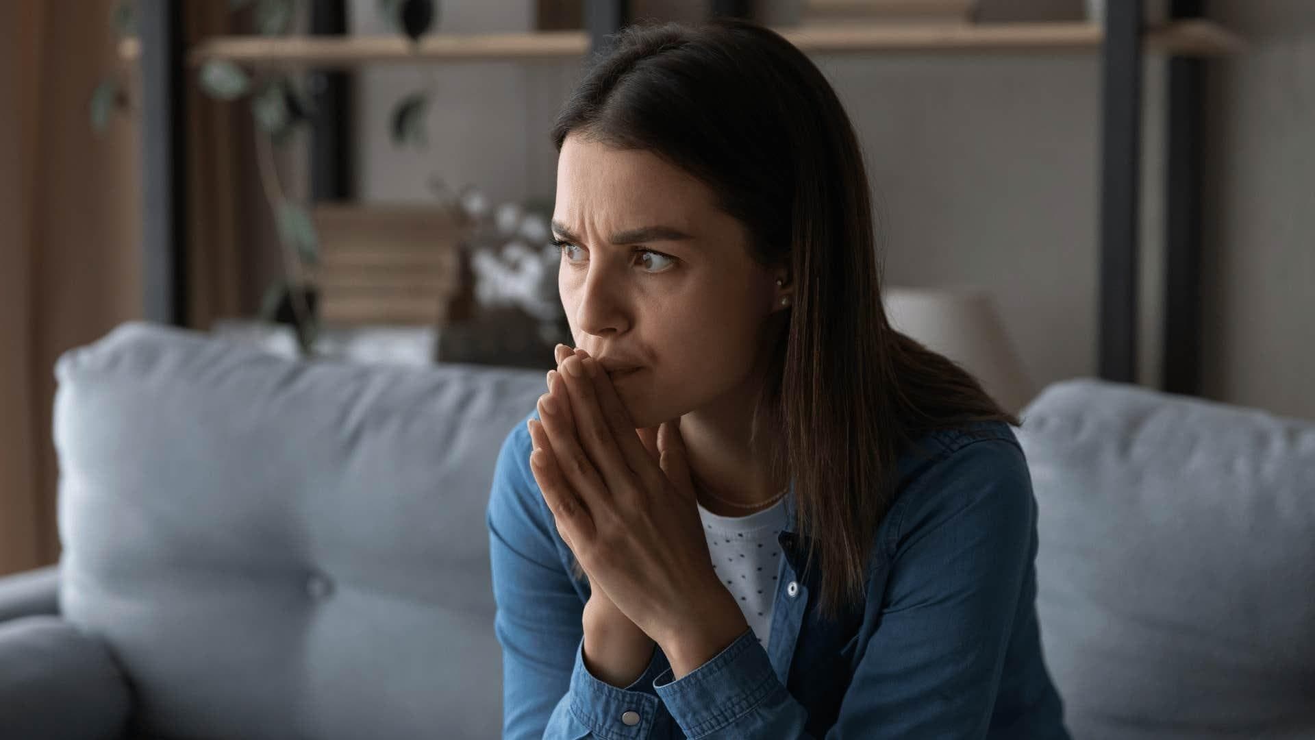 When Can CBT Support Be Helpful cbt and consultancy with Person sitting alone and thinking deeply, with a natural worried or confused expression for cognitive behavioral therapy counseling