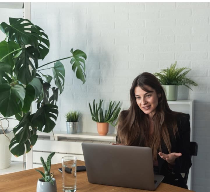 A counsellor hosting a session from a plant-filled desk, Career Growth